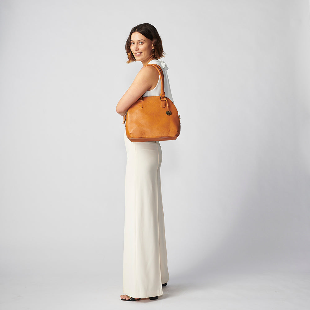 Buy Beige Donna Leather Structured Bag by ADISEE Online at Aza Fashions.