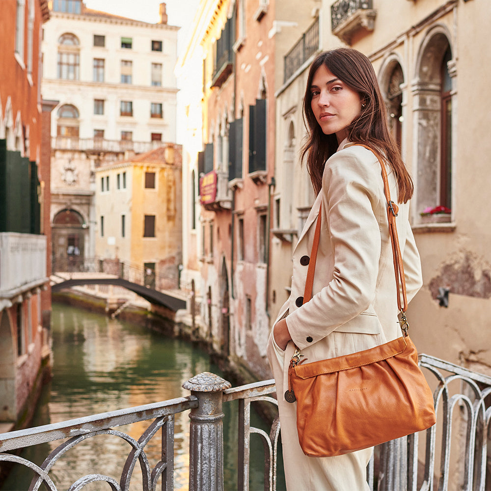 Mini venice grained store leather crossbody bag